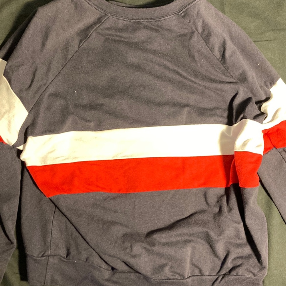 Navy blue long sleeve crew neck with white and red stripes